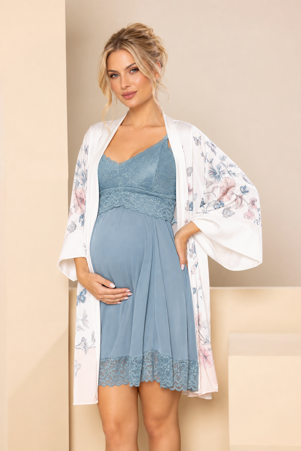 Expectant mother wearing a blue nightdress and floral robe